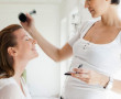 Make up artist working on client