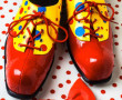 Clown shoes and a red bow tie